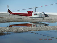 C-FMLT - Harding River, Nunavut, Canada (North West Passage) near the beach tanks.  C-FMLT is based in Cambridge Bay (CYCB): it is one of the HTSC helicopters currently contracted for flight operations in support of the North Warning System (NWS). - by T.B. Orlowski, BH12 Aircraft Captain