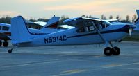 N9314C @ KFAR - Cessna 180 Skywagon taxiing to the ramp at Fargo Jet Center.
