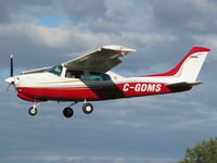 C-GDMS @ CYKZ - This gorgeous Centurion was on short final for rwy 33 on this Fall day. I like its new paint with the solid red belly. - by Chris Coates