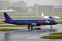 G-MIDM @ EHAM - Airbus A321-231 [1207] (Arkefly) Amsterdam-Schiphol~PH 10/08/2006. Taken in a rain storm. - by Ray Barber