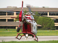 C-GYRP @ CYKZ - As this Police chopper was cleared for takeoff & was flying away towards the runway the crew still followed me with their high powered camera lens. It was neat to see the white camera working. - by Chris Coates