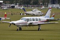 G-FCSL @ EGHR - PA31 Chieftain parked at the Goodwood Revival 2013. It still wears the color scheme of former owner Quick Airways. Logo on its tail and C on nosewheel door. (Ex PH-PTC) - by FerryPNL