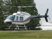 C-FQCK @ CYYB - This helicopter just lifted off at North Bay Intl & then headed north on a scenic flight to see the wonderful Fall colours in the wild forest below. - by Chris Coates
