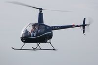 G-MDKD @ EGFH - Resident R-22 helicopter in a new dark blue colour scheme. Operated by Heli-air Wales at the airport. - by Roger Winser