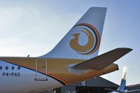 P4-PAS @ EGHH - Just painted..tail details - by John Coates