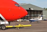 G-MLLI @ EGHH - OSRA crew ferry with big brother. - by John Coates