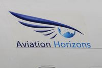 HZ-HAA @ EGHH - Aviation Horizons titles near cabin door. - by John Coates