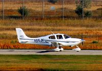 N86JK @ KGFK - Cirrus SR22 taking off runway 17L.