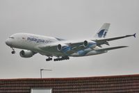 9M-MNC @ EGLL - Low finals to 27L in heavy drizzle. - by John Coates