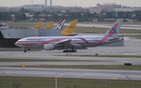 N759AN @ MIA - American 777 Pink ribbon