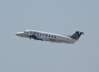 N69549 @ KTPA - This 1996 Beech 1900D climbs off rwy 36L at Tampa Int'l Airport - by Ron Coates