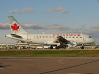 C-FYKW @ CYYZ - This 1997 Airbus 319 is taxiing to terminal after landing at Toronto Int'l Airport