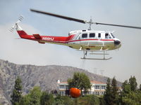 N66HJ - Taken during the Station fire in 2009.  N66HJ had just filled it's bucket from a water hazard at the Flintridge Country Club Golf Course. - by Richard Eyster
