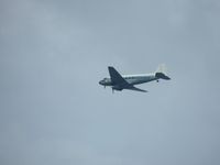 N300MF - DC-3 flying over Miami Beach - by Paul H