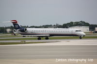 N905FJ @ KSRQ - US Air Flight 2675 operated by Mesa (N905FJ) arrives at Sarasota-Bradenton International Airport following a flight from Charlotte-Douglas International Airport - by Donten Photography