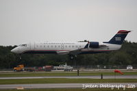 N223JS @ KSRQ - US Air Flight 4594 operated by PSA (N223JS) arrives at Sarasota-Bradenton International Airport following a flight from Reagan National Airport - by Donten Photography