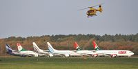 G-WPDC @ EGHH - Departing past an impressive line of 737s at European Aviation - by John Coates