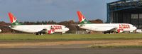 G-TOYF @ EGHH - With sister ship G-TOYH awaiting the fitting of new seats at European Aviation - by John Coates