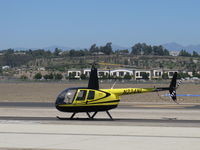 N234NL @ CMA - 2004 Robinson R44 RAVEN II, Lycoming IO-540-AE1A5 derated to 245 Hp for 5 minutes, 205 Hp continuous, on airshow ramp awaiting paid airshow passengers - by Doug Robertson