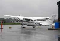 N244ME @ KOQN - Powerful Cessna sits on rain-soaked apron at Brandywine Airport. - by Daniel L. Berek