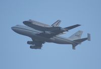 OV-105 @ MCO - Space Shuttle Endeavor riding on the back of the 747 over Orlando International Airport - by Florida Metal