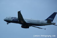 N662JB @ KSRQ - JetBlue Flight 432 (N662JB) Glad to be Blue departs Sarasota-Bradenton International Airport enroute to Laguardia Airport - by Donten Photography