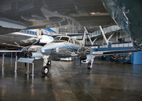 66-7943 @ DWF - The much larger presidential VC-135C frames this handsome little Beech VC-6A. - by Daniel L. Berek