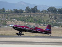 N46EX @ CMA - 1993 Extra Flugzeugbau Gmbh EXTRA EA300/S short wing version, Lycoming AEIO-540 300 Hp, Vicki Benzing-pilot, taxi to Rwy 26 for fast low level extreme aerobatics show. Experimental class production aircraft. - by Doug Robertson