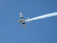 N1038A @ CMAQ - 1944 North American SNJ-5 'WAR DOG', P&W R-1340 Wasp 600 Hp, low level airshow with smoke - by Doug Robertson