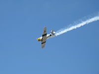 N1038A @ CMA - 1944 North American SNJ-5 'WAR DOG;', P&W R-1340 Wasp 600 Hp, low level airshow with smoke - by Doug Robertson