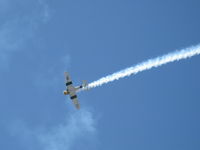 N1038A @ CMA - 1944 North American SNJ-5 'WAR DOG', P&W R-1340 Wasp 600 Hp, low level airshow with smoke - by Doug Robertson