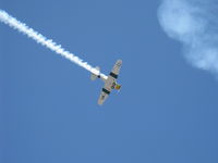 N1038A @ CMA - 1944 North American SNJ-5 'WAR DOG', P&W R-1340 Wasp 600 Hp, low level airshow with smoke - by Doug Robertson