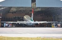 HA-SHA @ EGHH - Getting a leg up to exit the hangar - by John Coates