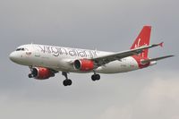 EI-EZW @ EGLL - On approach to 27L - by John Coates