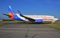 G-GDFN @ EGHH - Departing after respray - by John Coates