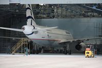 SX-OAM @ EGHH - In paintshop just resprayed to Aegean livery - by John Coates