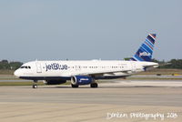 N594JB @ KSRQ - JetBlue Flight 164 (N594JB) Whole Lotta Blue prepares for flight at Sarasota-Bradenton International Airport - by Donten Photography