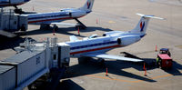 N810AE @ KDFW - Baggage operations Gate B12 DFW - by Ronald Barker
