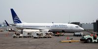 HP-1520CMP @ MGGT - Copa International Airlines Boeing 737 docked at Guatemala City la Aurora International Airport - by miro susta