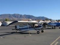 N3257B @ SZP - 1954 Piper PA-18-135 SUPER CUB, Lycoming O-320 upgrade operated uncowled, lengthened wings, droop tips, aileron fences, lady flown & hand-propped, Restricted class - by Doug Robertson