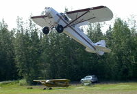 N6191R - Taking off from a grass strip along the Chena River at Fairbanks. - by Murray Lundberg