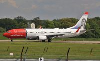 LN-NOE @ EGKK - Taxiing to depart 08R - by John Coates