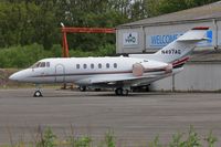 N497AG @ EGHH - ex CS-DNL Parked at JETS - by John Coates