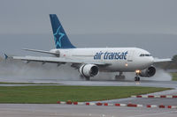 C-GTSY @ EGCC - Air Transat, arriving in the rain. - by Howard J Curtis