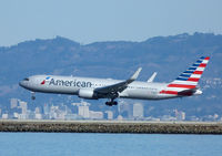 N348AN @ SFO - Landing at SFO - by Bill Larkins