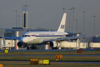 OY-KBO @ EGCC - Scandinavian Airlines retro scheme - by Chris Hall