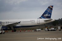 N584JB @ KSRQ - JetBlue Airbus A320 (N584JB) stranded at Sarasota-Bradenton International Airport following Winter Storm Hercules in the Northeast - by Donten Photography