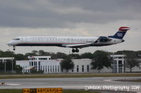 N935LR @ KSRQ - US Air Flight 2675 operated by Mesa (N935LR) arrives at Sarasota-Bradenton International Airport following a flight from Charlotte-Douglas International Airport - by Donten Photography