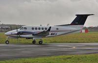 M-WATJ @ EGHH - Regular visitor arriving at Signatures - by John Coates