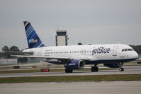 N648JB @ KSRQ - JetBlue Flight 164 (N648JB) That's What I Like About Blue prepares for flight at Sarasota-Bradenton International Airport - by Donten Photography